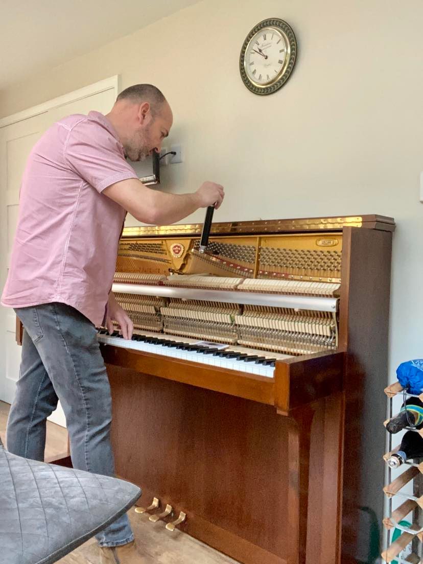 tuning an upright piano in Rusper
