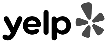 The yelp logo is black and white with a flower in the middle.