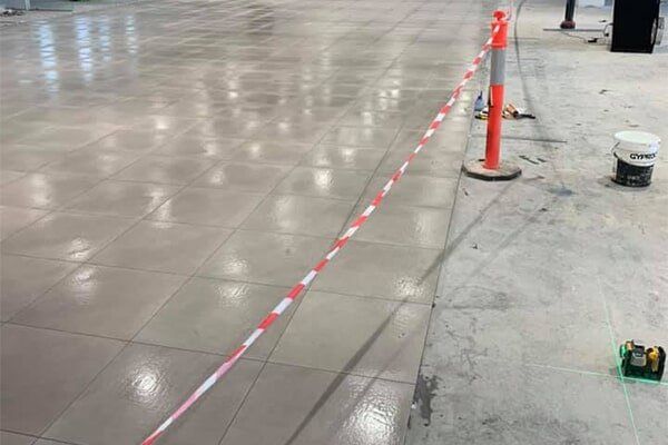 Installation of Tile Flooring On Commercial Space — Wall And Floor Tiling in Central Coast, NSW