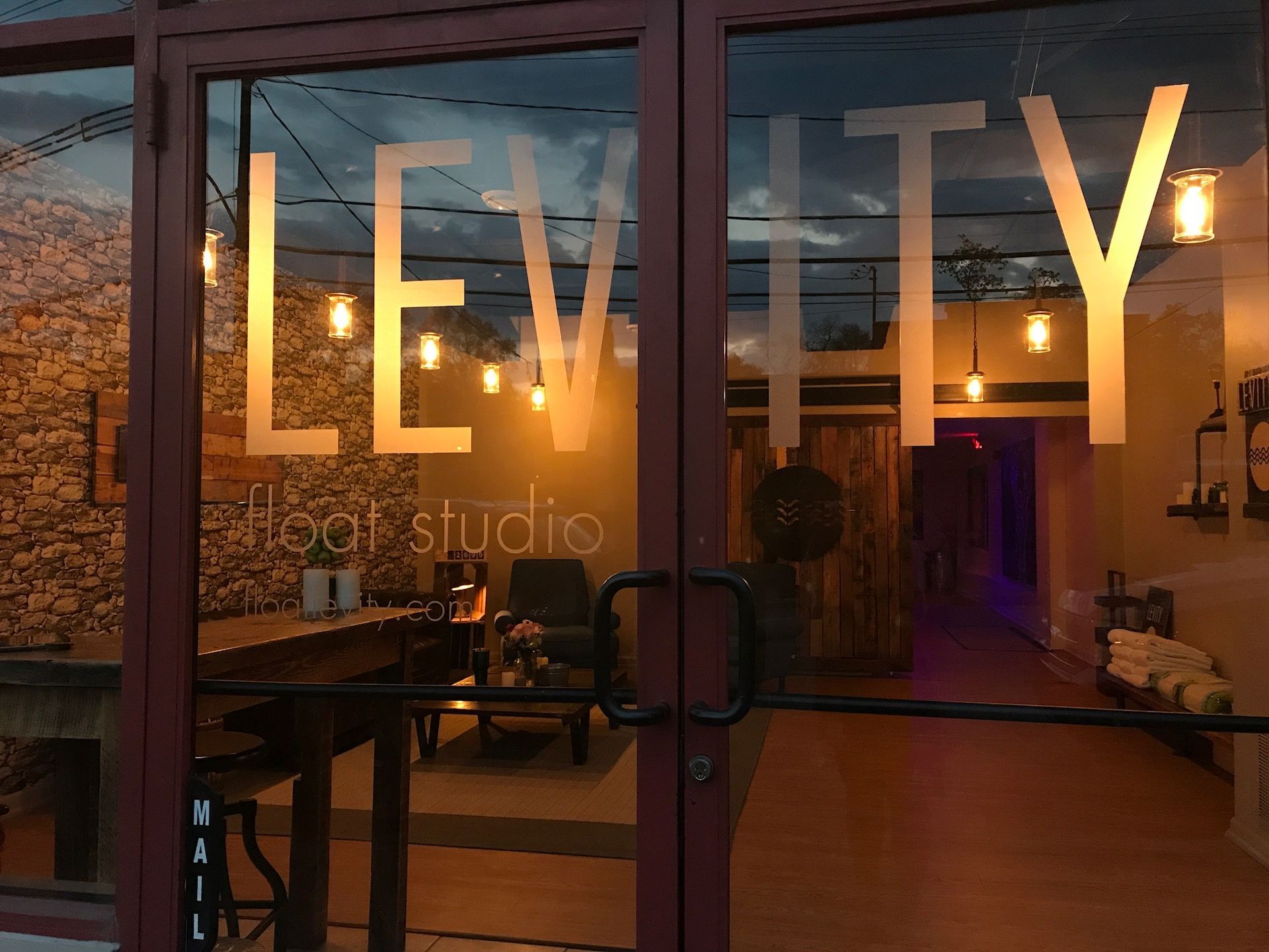 The word levity is on the glass door of a building