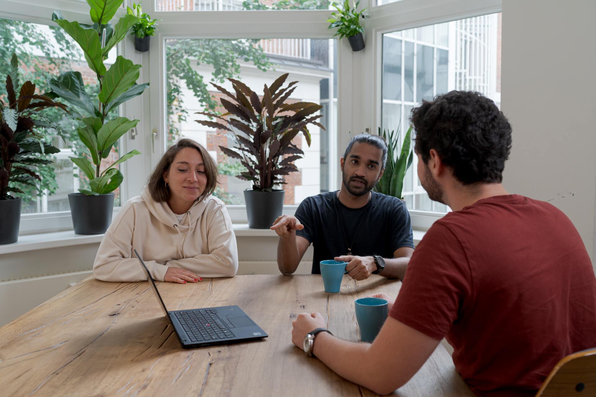 image of three people in a meeting