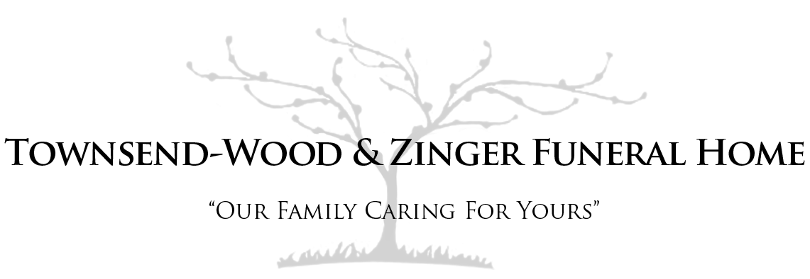 Logo for Townsend-Wood & Zinger Funeral Home, featuring a tree graphic and text 
