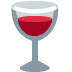 Glass of red wine, filled about halfway, in a clear glass with a long stem.
