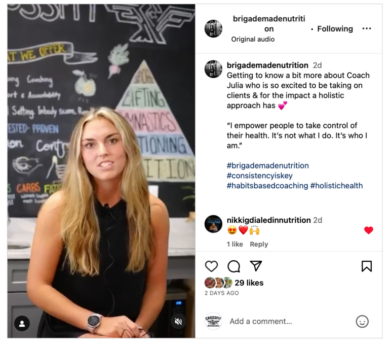Woman speaking in front of a chalkboard with health-related terms. She is promoting coaching on Instagram.