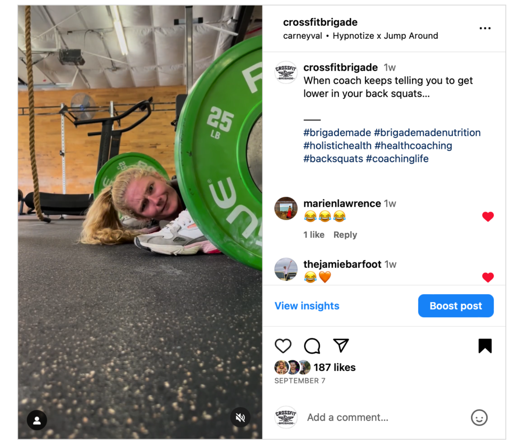 Woman smiling under a green weight plate at a gym, with text on Instagram post.