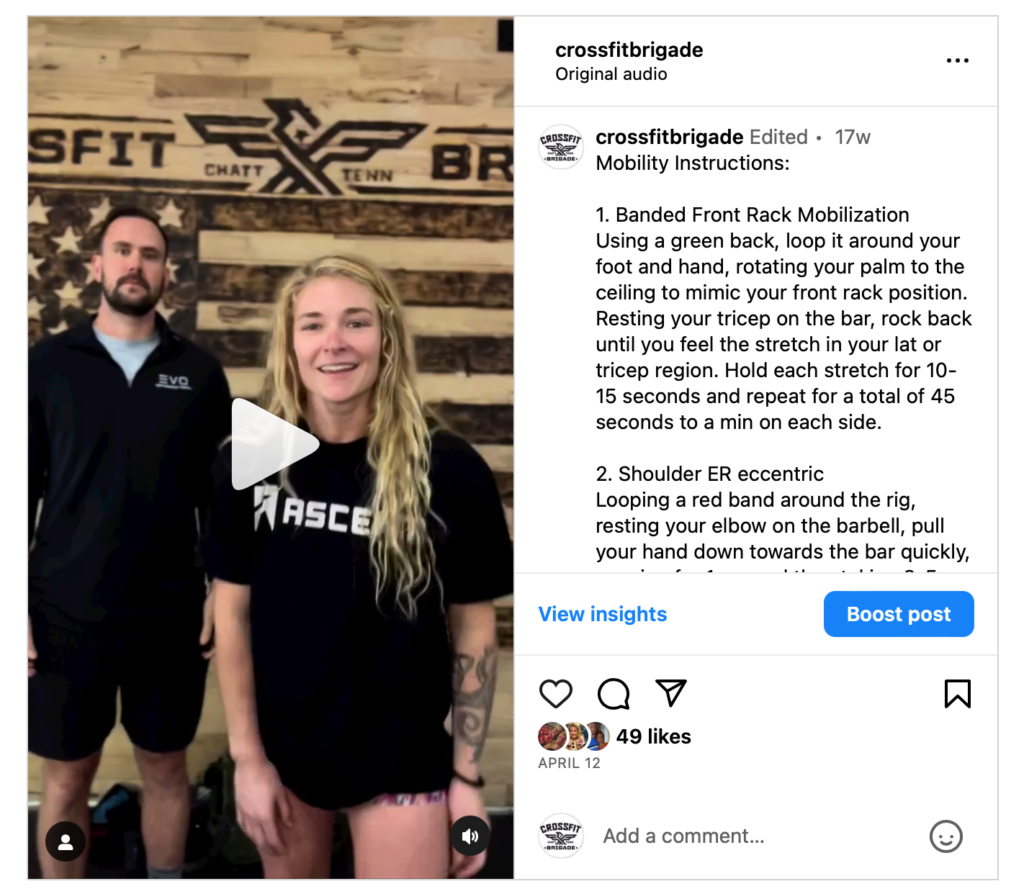 A man and woman demonstrating CrossFit exercises, with workout instructions on screen.