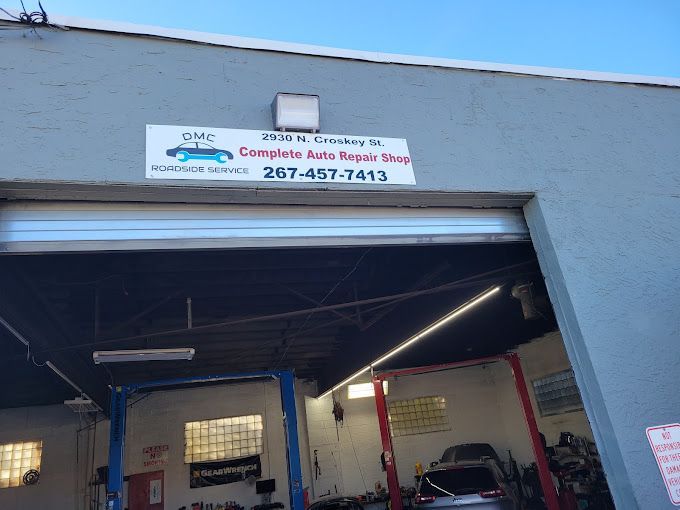 A garage with a sign that says complete auto repair shop