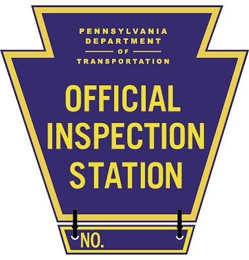 A pennsylvania department of transportation official inspection station sign