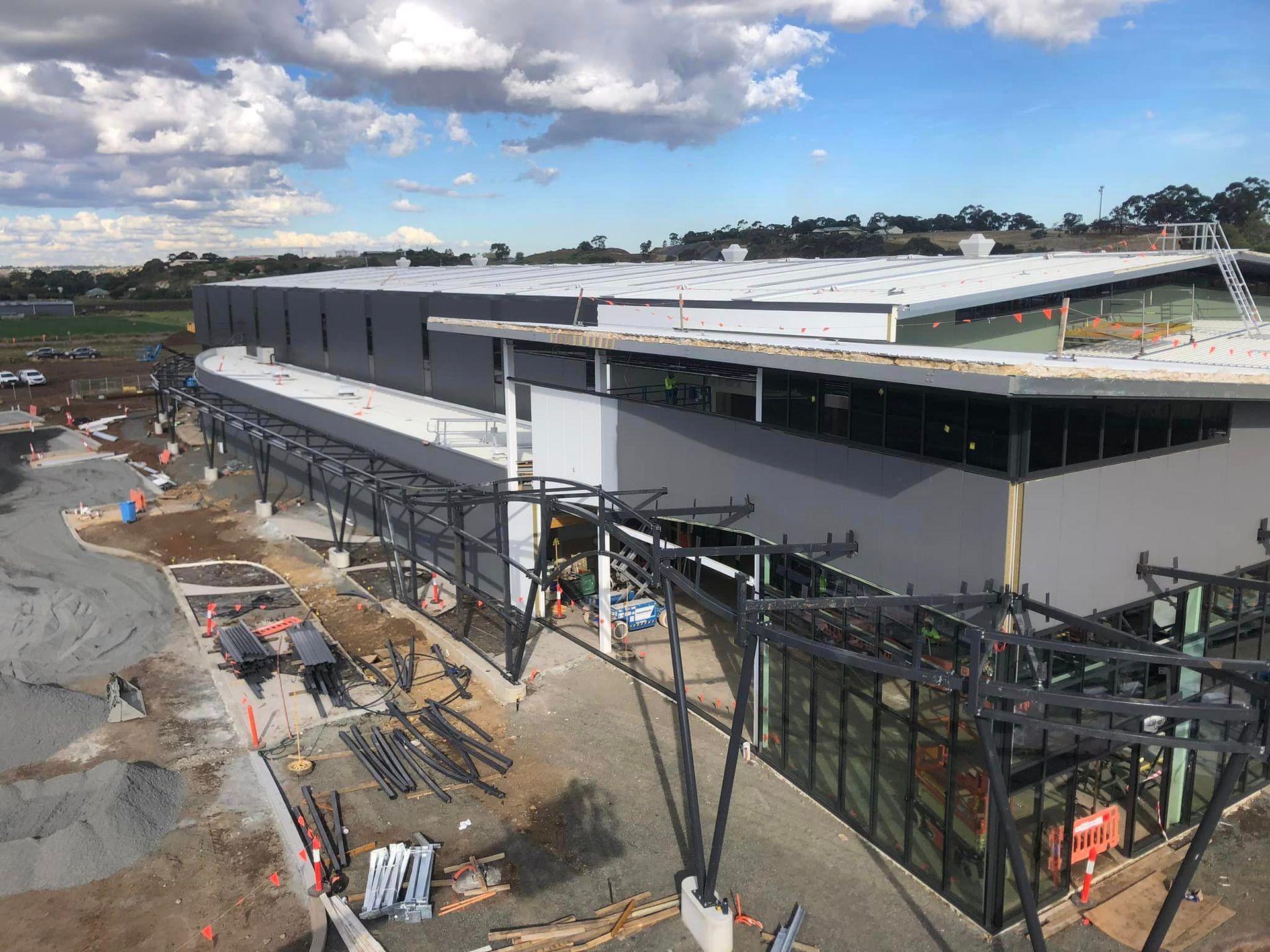 An aerial view of a large building under construction.