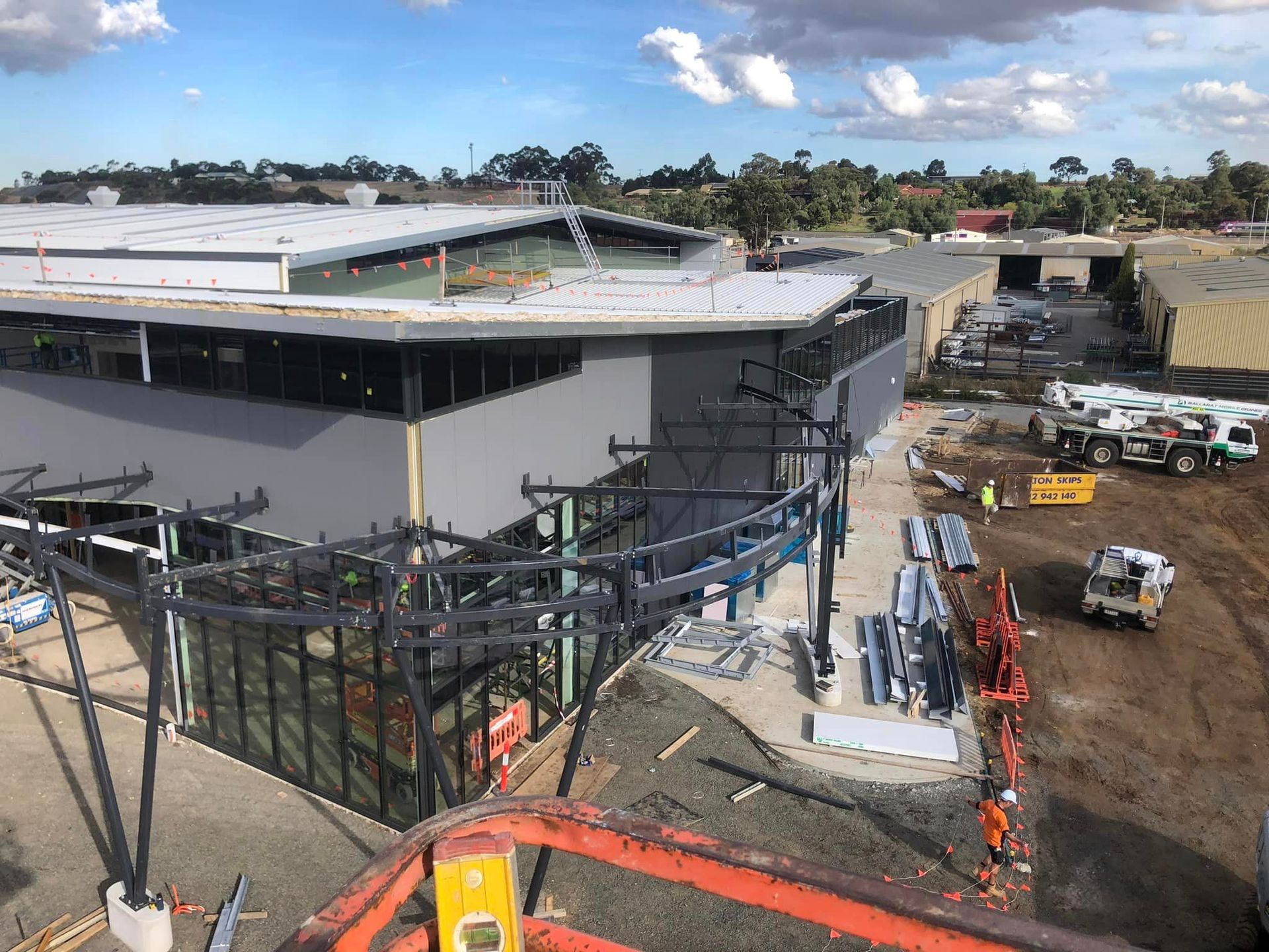 An aerial view of a large building under construction.