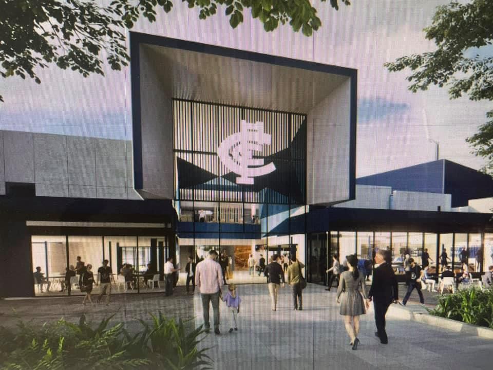 A group of people are walking in front of a building with a large logo on it