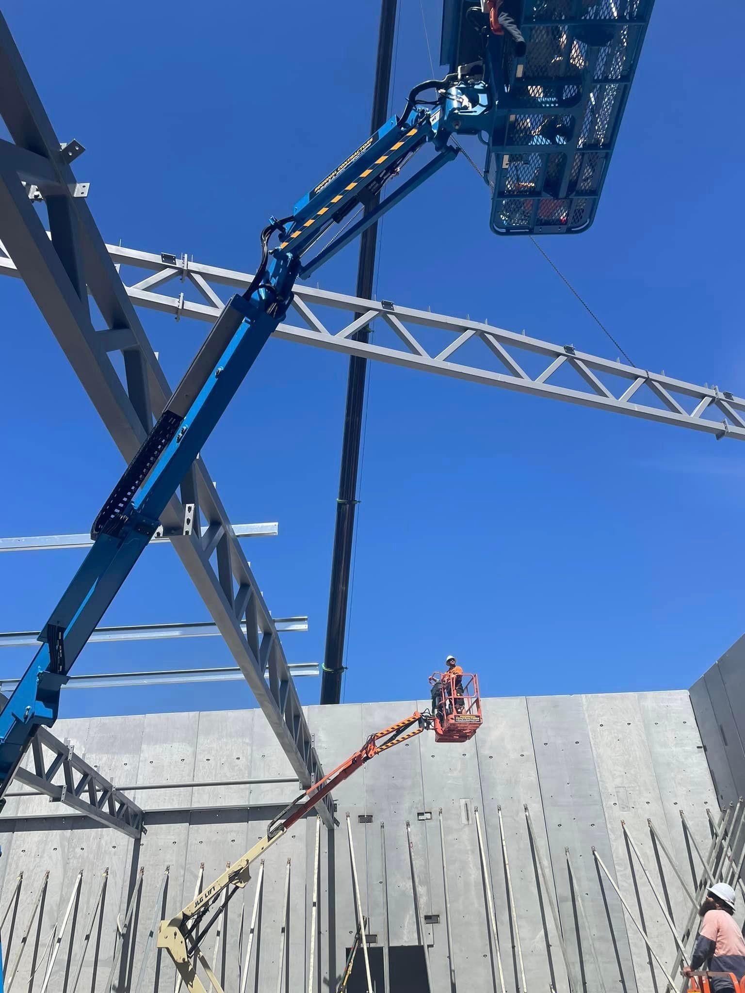 A group of construction workers are working on a building.