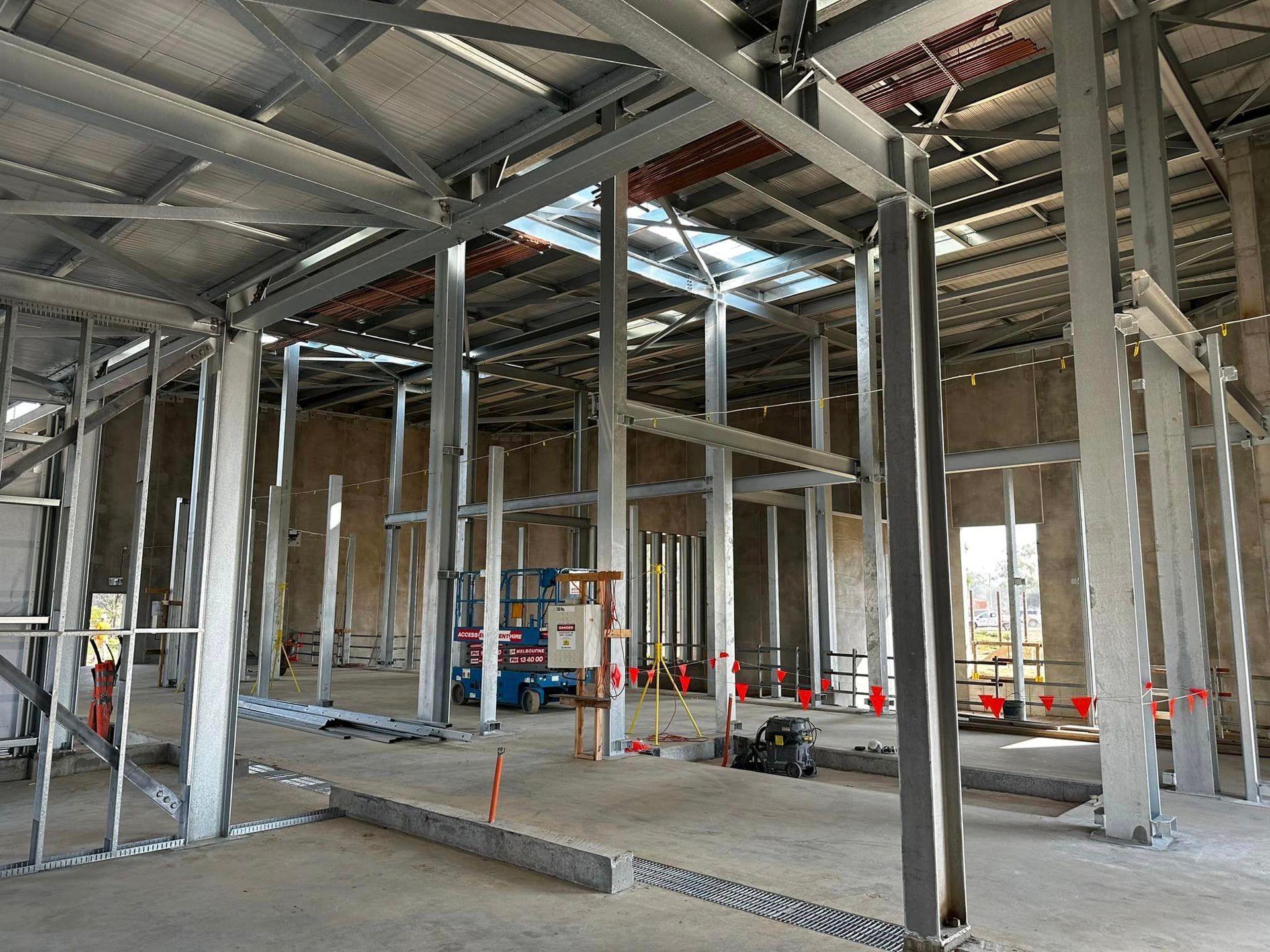 A large building under construction with a lot of steel beams