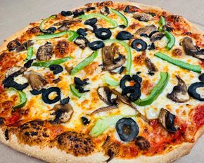 Veggie Pizza, Fresh and flavorful! Topped with mushrooms, onions, green peppers, and black olives.
