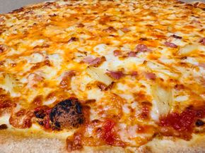 Hawaiian Pizza, One of the classics! Topped with ham, sweet pineapple, and extra mozzarella cheese.