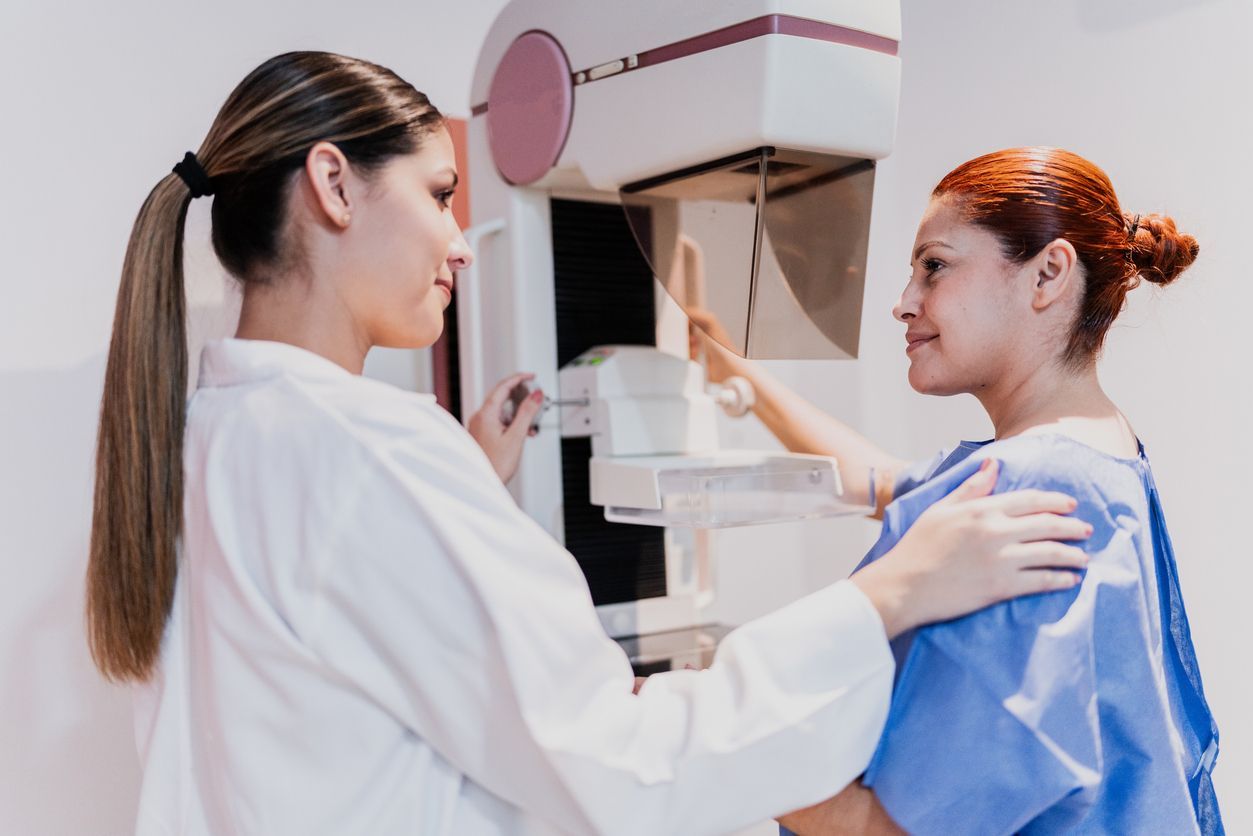 A female doctor will do a mammography exam on a female patient in the hospital. 