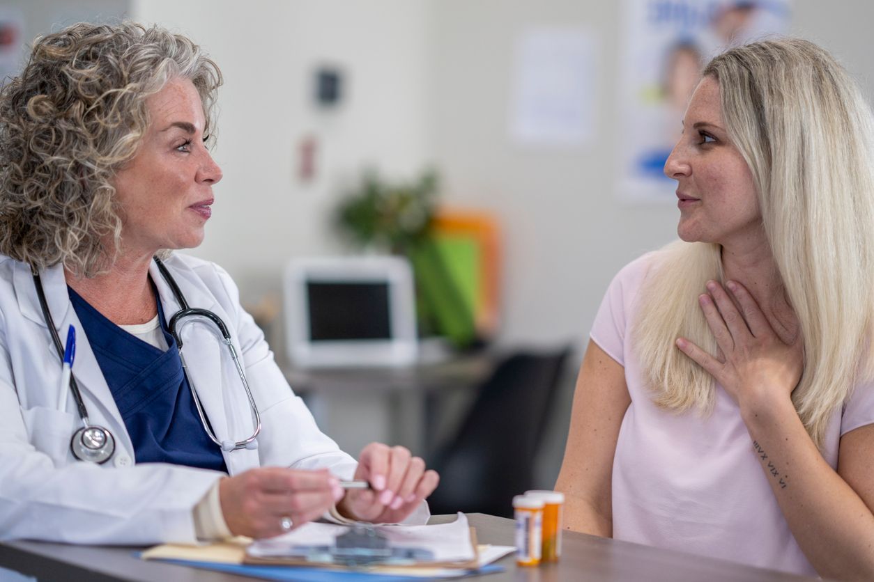 A woman patient is talking to her doctor about her hormonal imbalance.