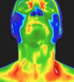 A thermal image of a man 's face and neck