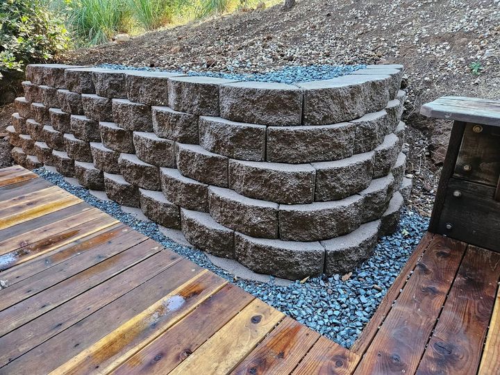 A stone wall is sitting on top of a wooden deck.