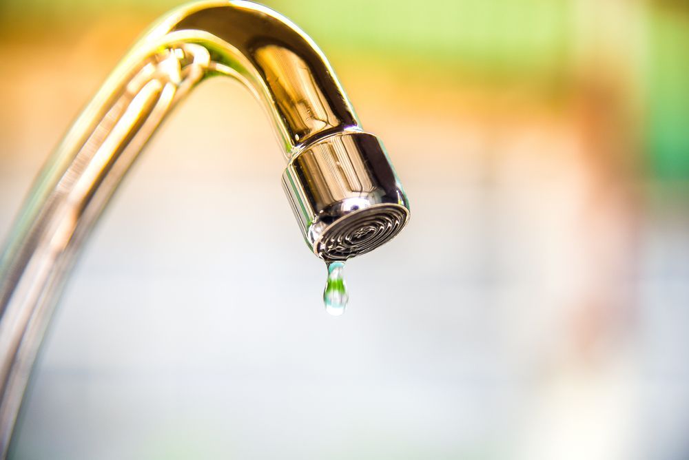 A Close Up of a Faucet With Water Dripping From It — Pimlico Plumbing in Mount Louisa, QLD