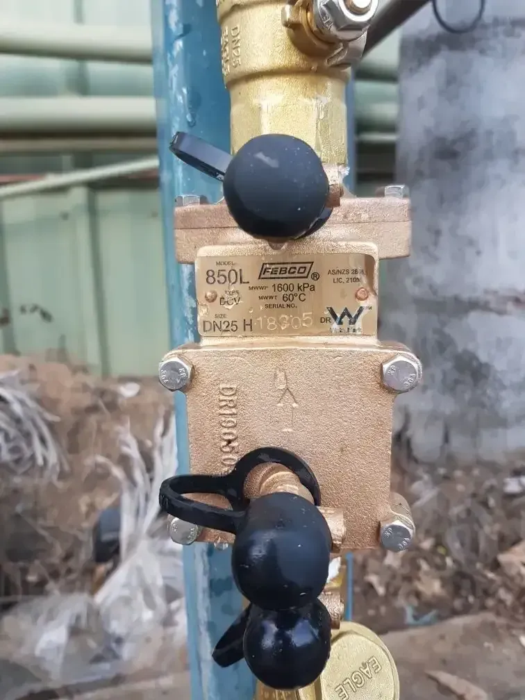 A Close Up of a Brass Valve on a Metal Pole — Pimlico Plumbing in Mount Louisa, QLD