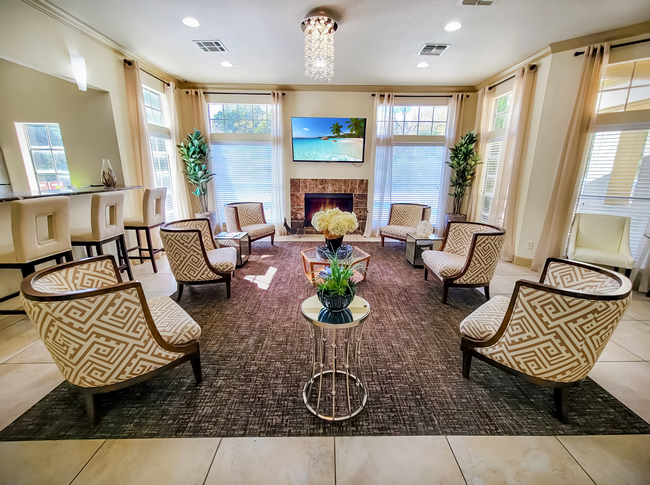 A living room filled with furniture and a fireplace.
