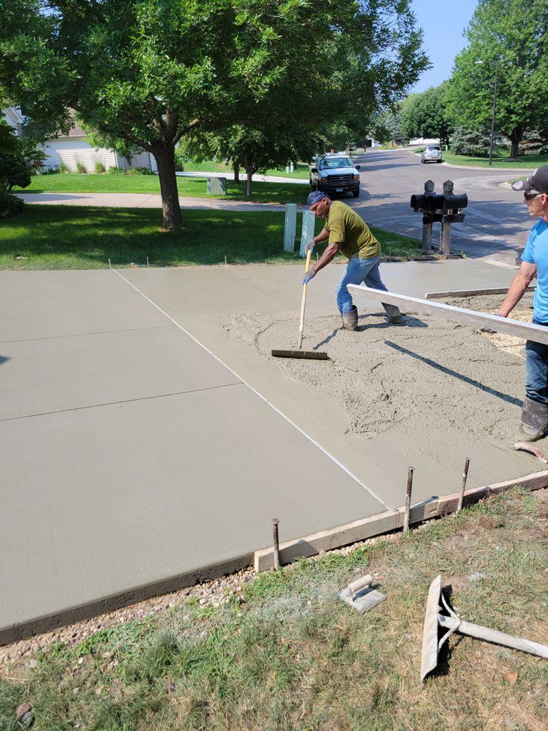 Workers Sealing the Driveway — St Paul, MN — Joseph Construction of St. Paul, Inc