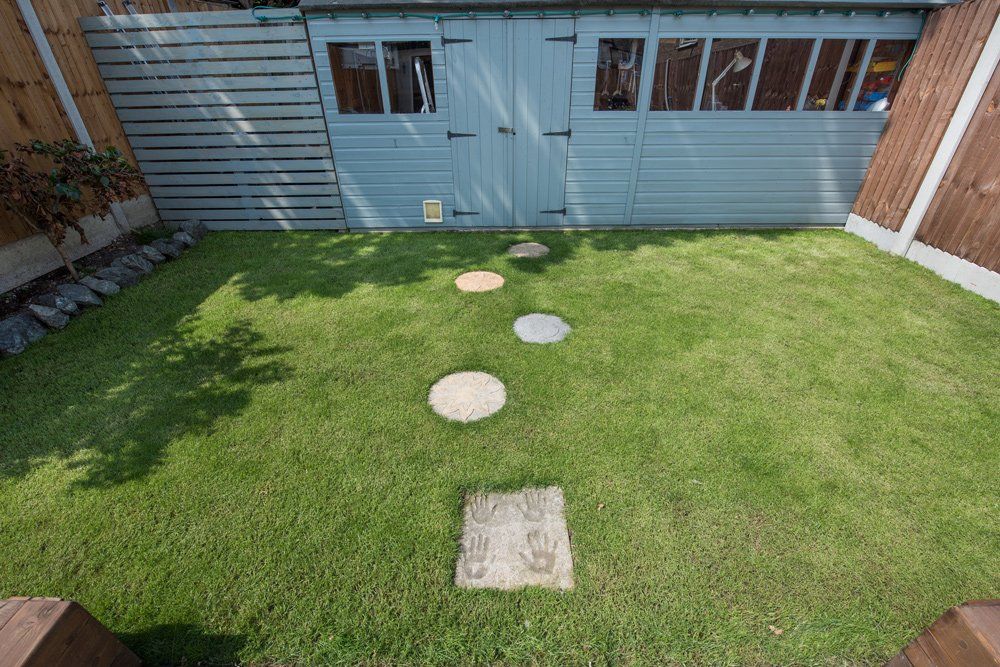 Gray Shed with Stepping Stones — St Paul, MN — Joseph Construction of St. Paul, Inc