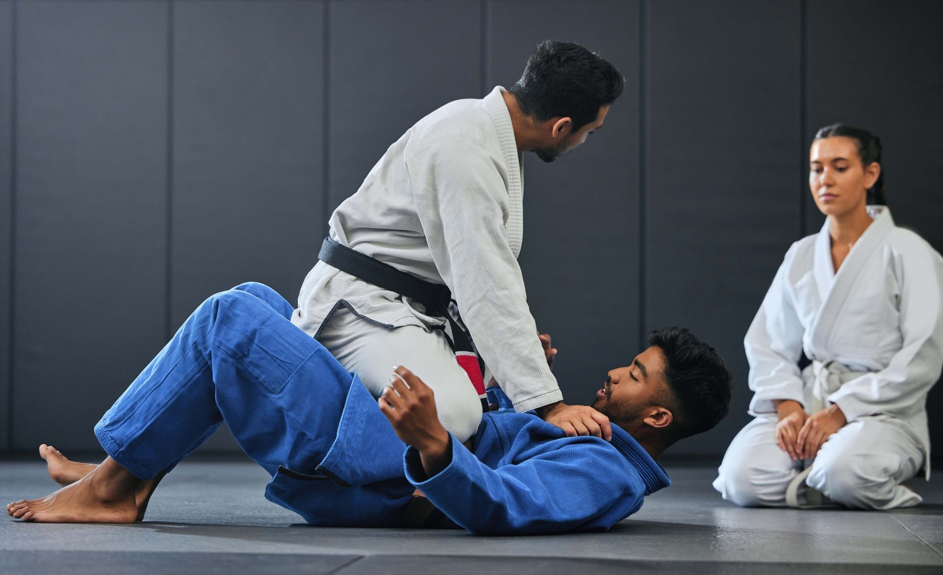 A martial arts instructor teaching a lesson on fighting and defense training. A martial arts instructor teaching a lesson on fighting and defense training.