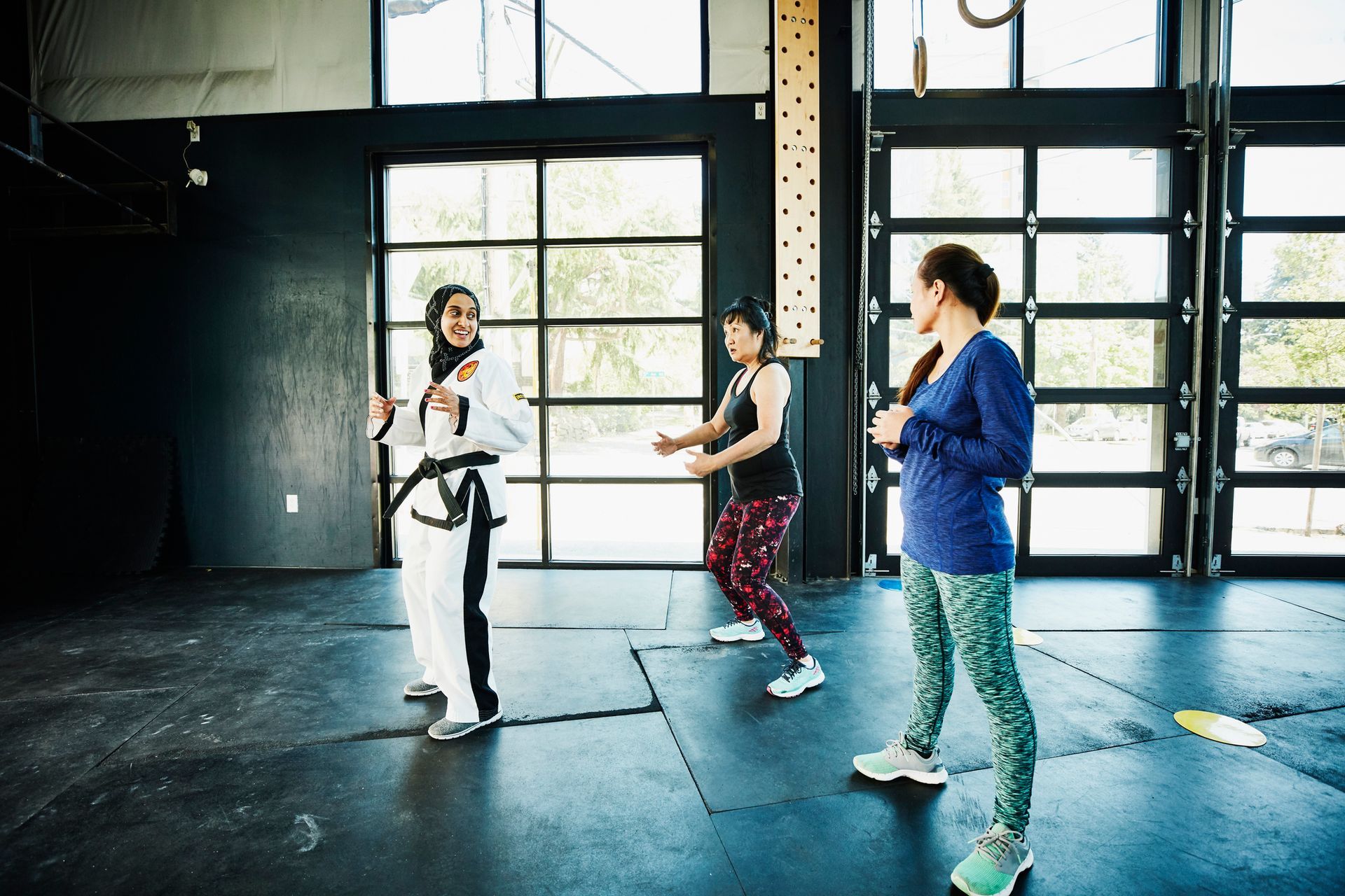 Two women in a martial art class. Two women in a martial art class.