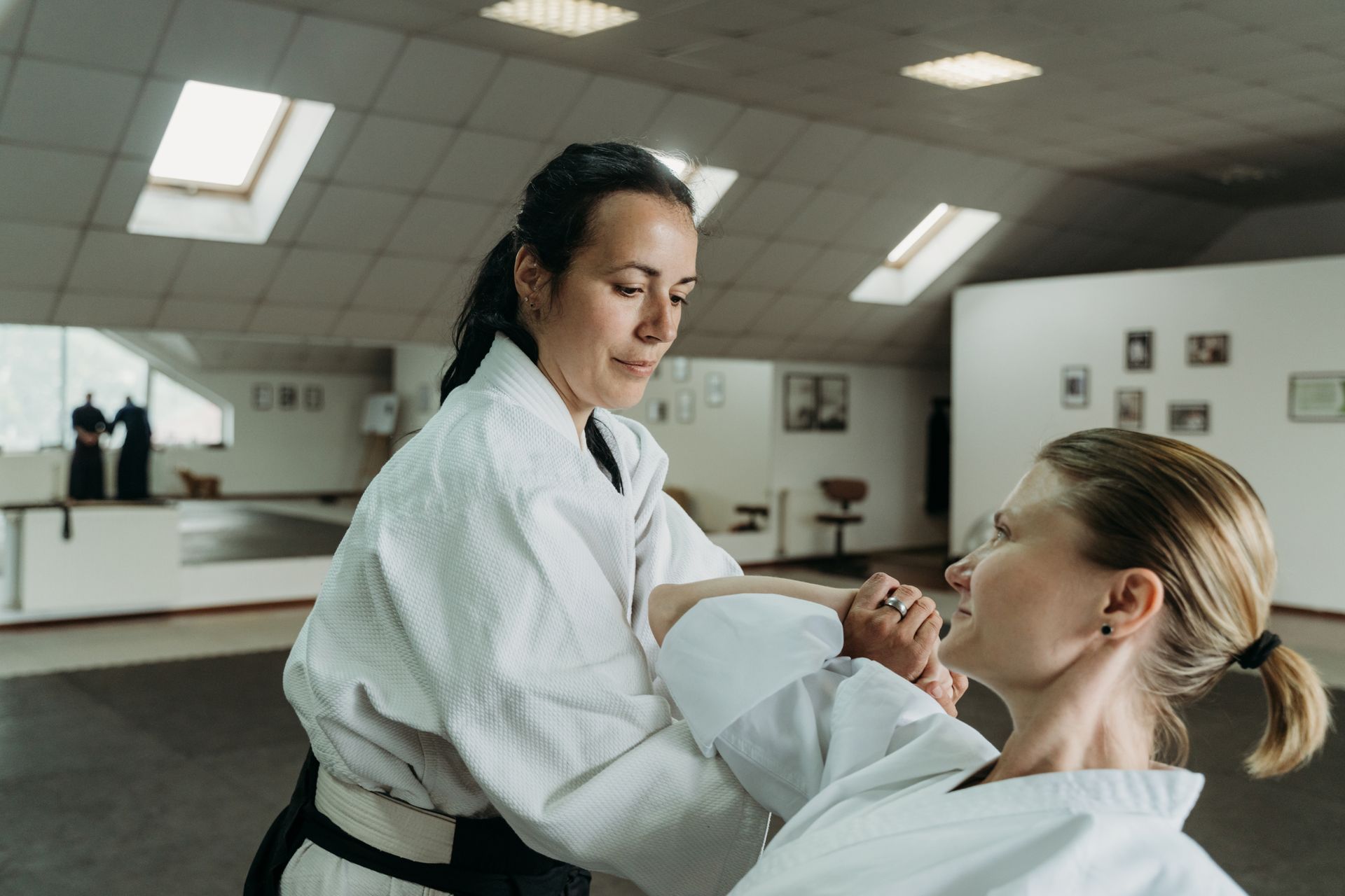 Women are practicing martial arts.