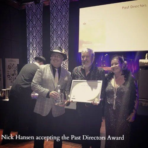 nick accepting award