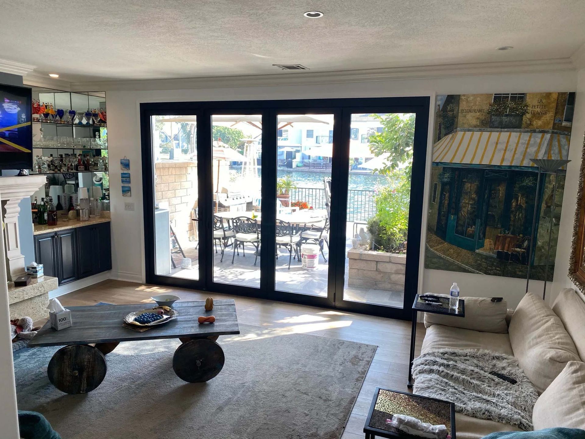 A living room with sliding glass doors leading to a patio.