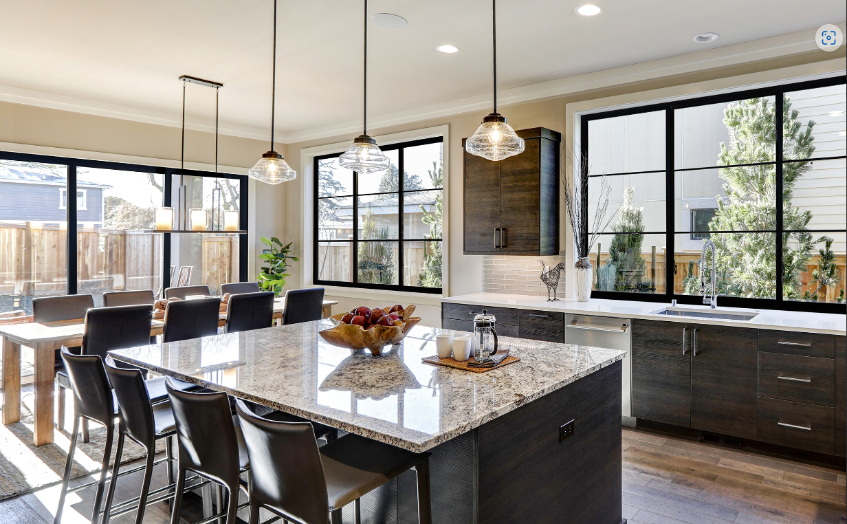 A room with sliding glass doors leading to a patio.