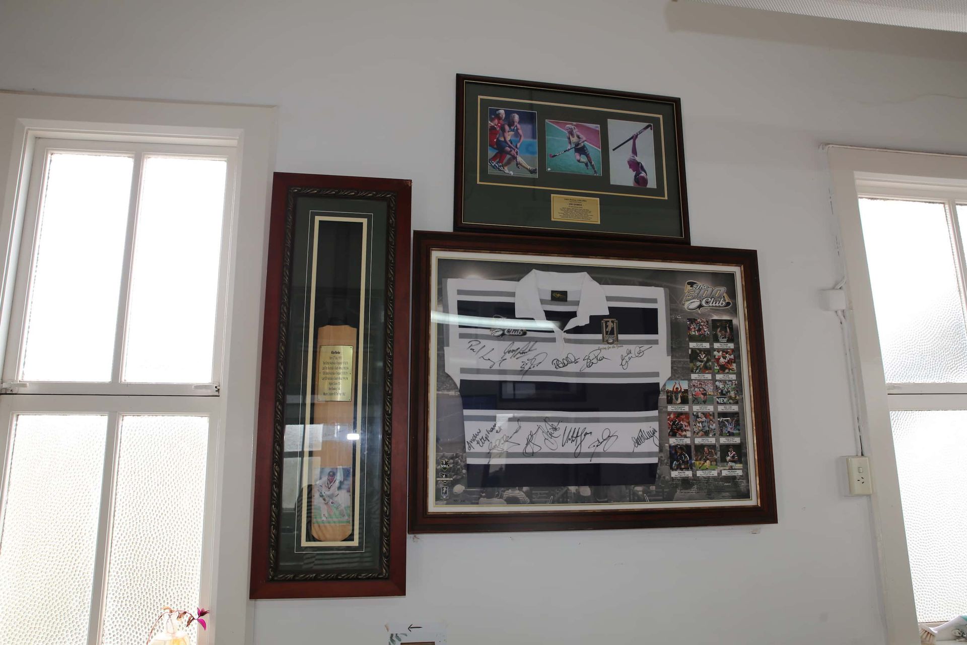 Framed sporting memorabilia 