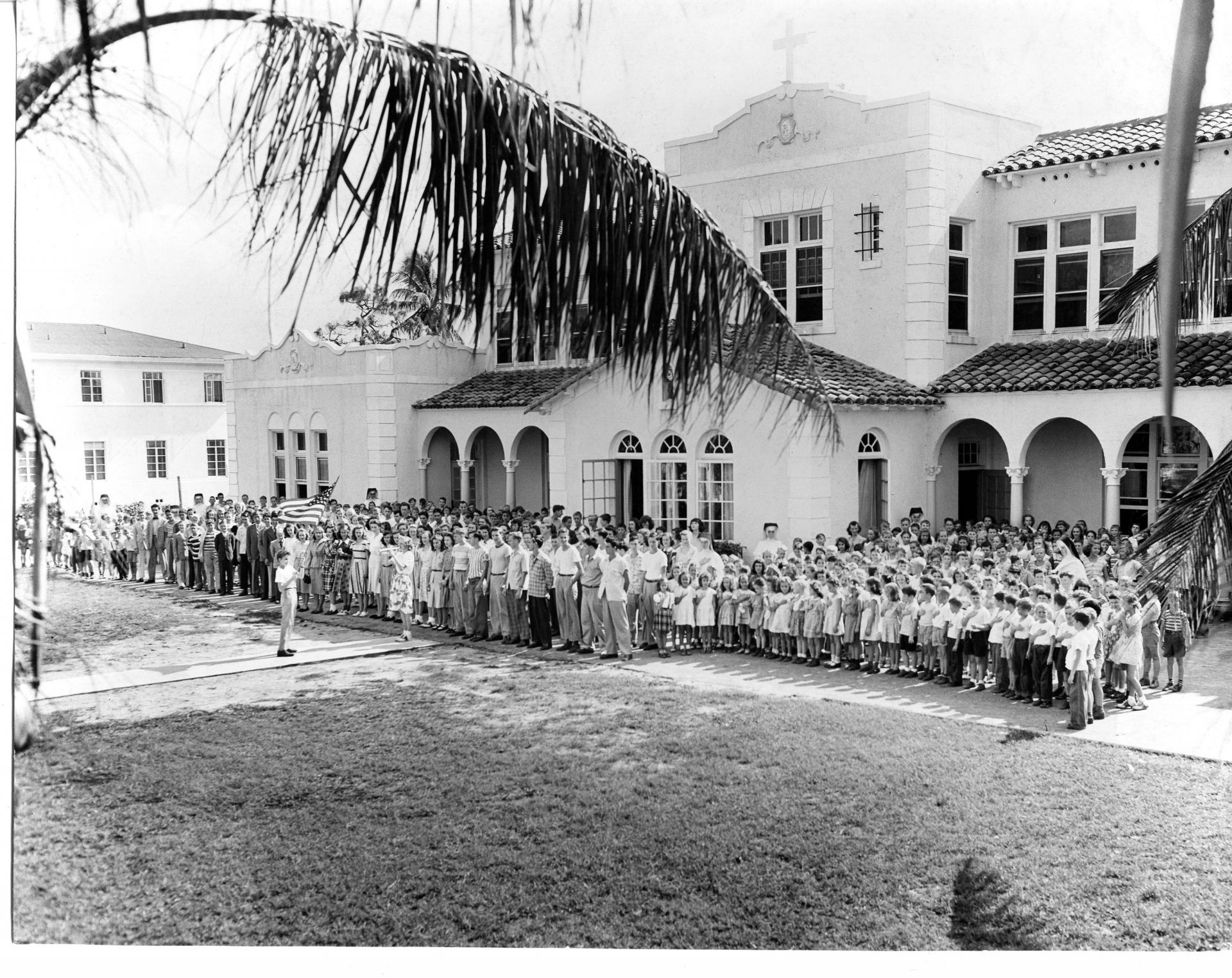 a large group of people standing in front of a building