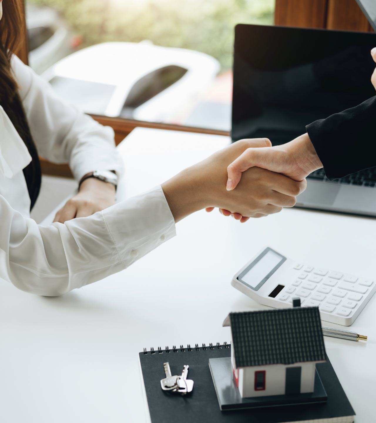 A man and a woman are standing in a room with cardboard boxes.