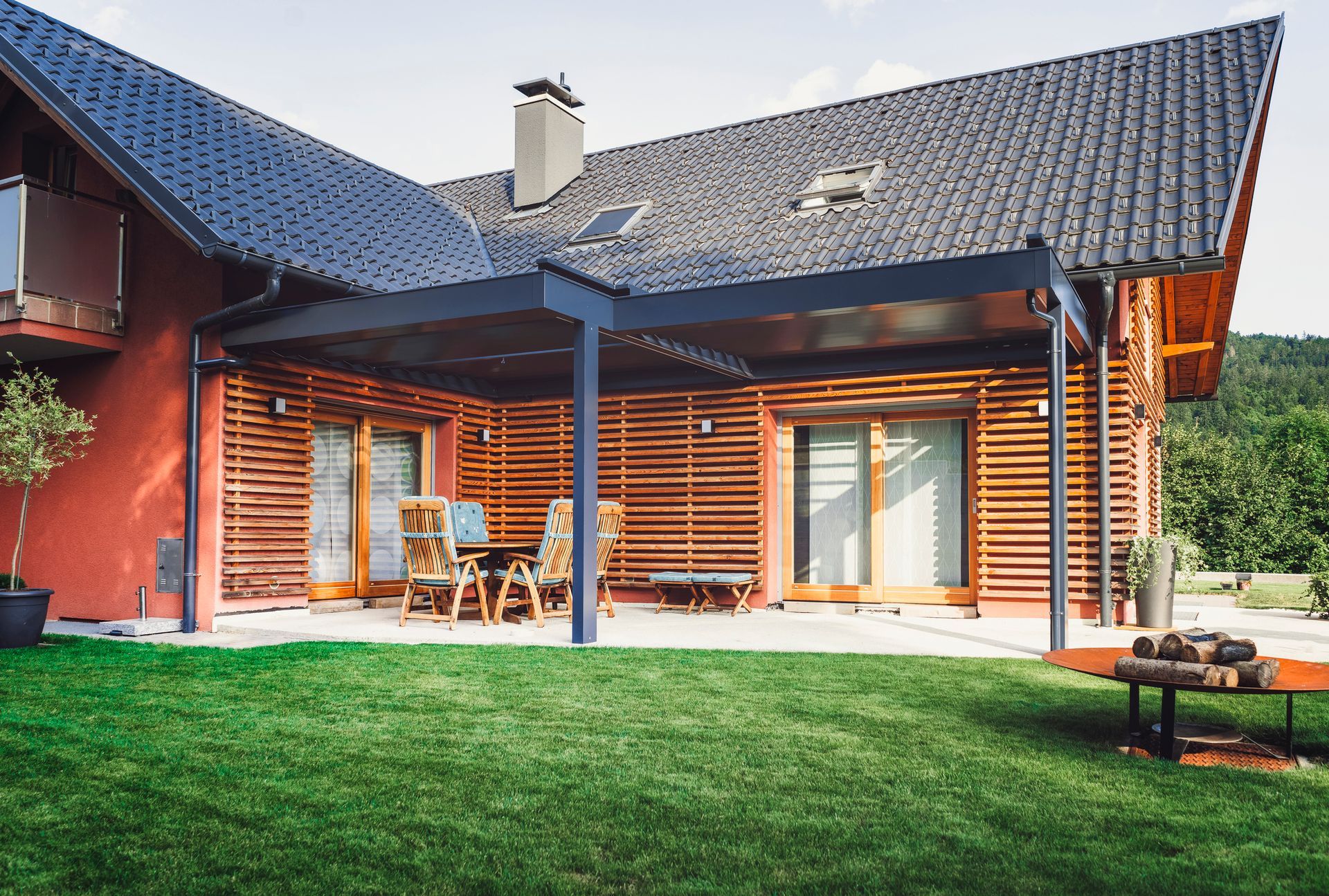 A large house with a large lawn in front of it.