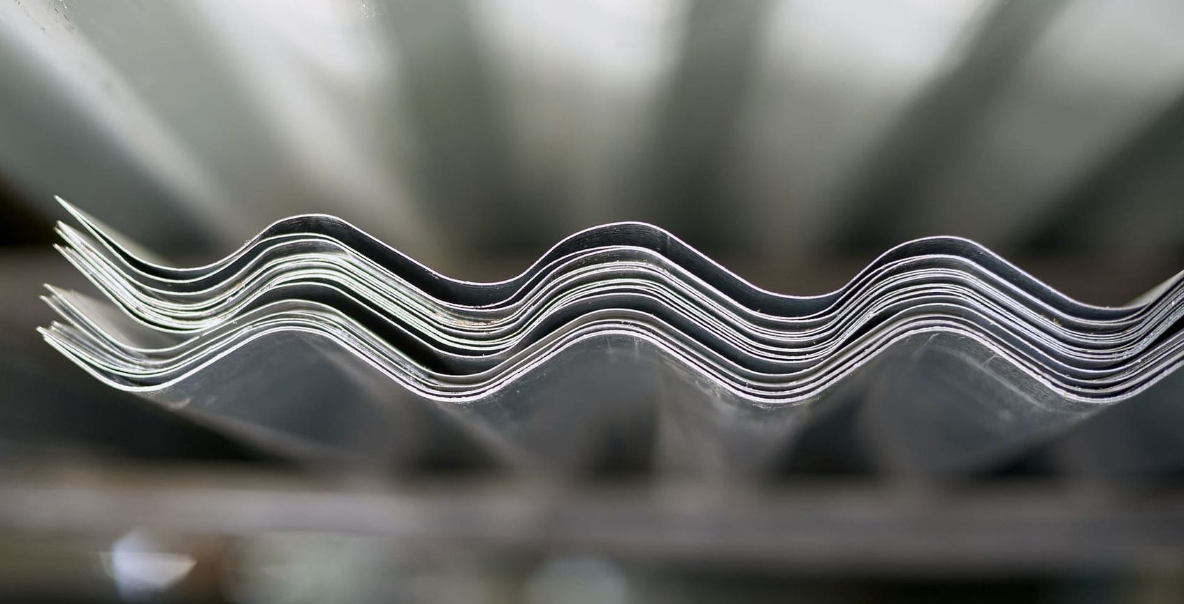 A close up of a stack of corrugated metal sheets.
