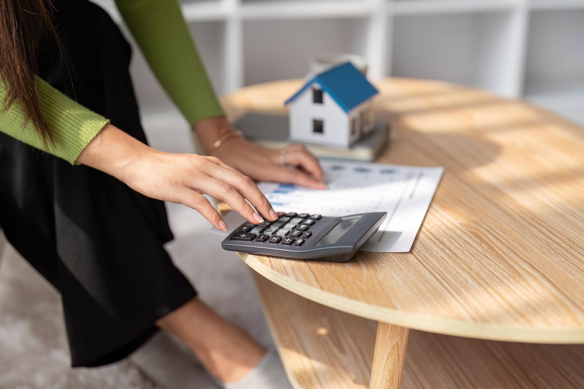 Property owner calculating property management costs