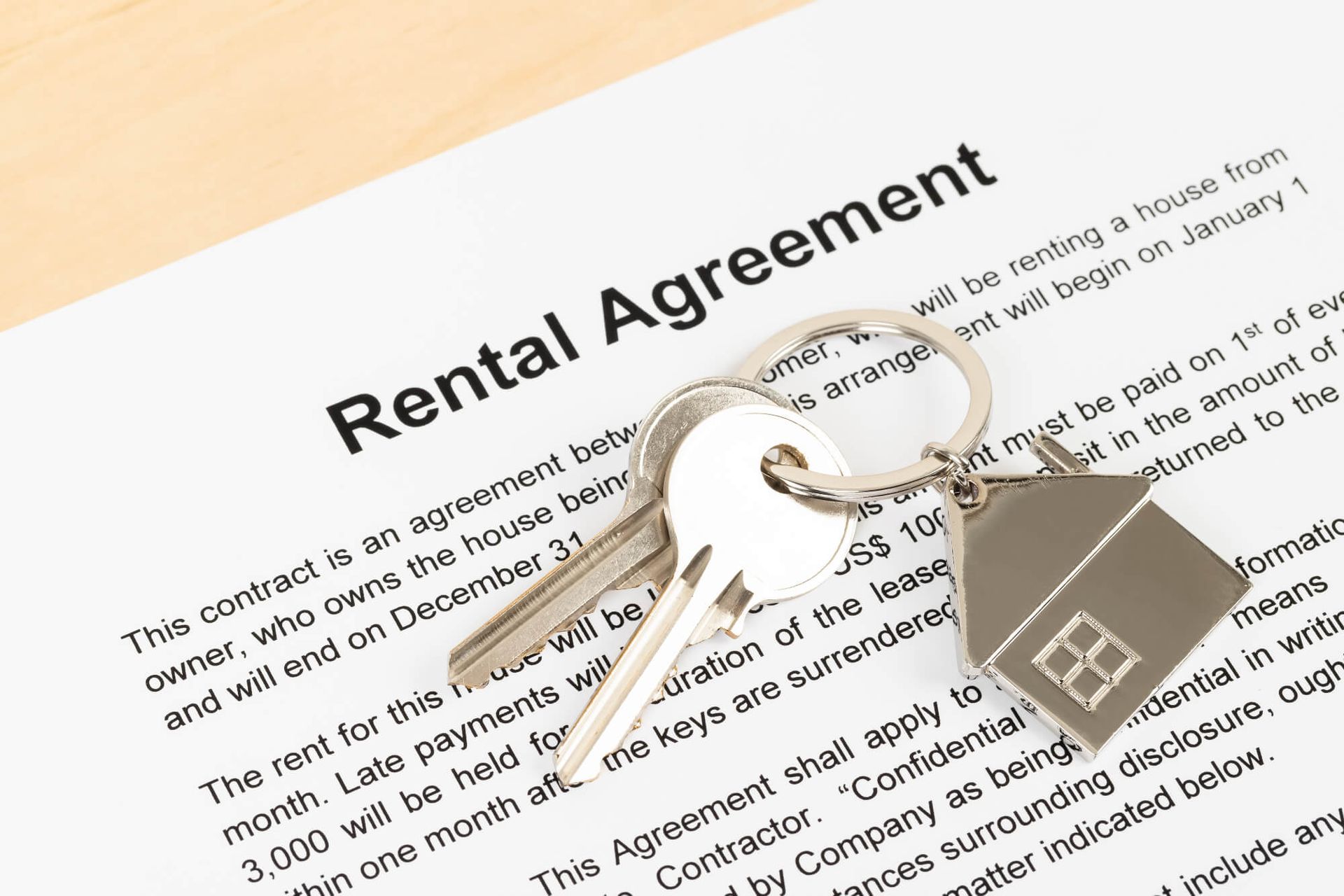 House keys on top of Utah rental contract template