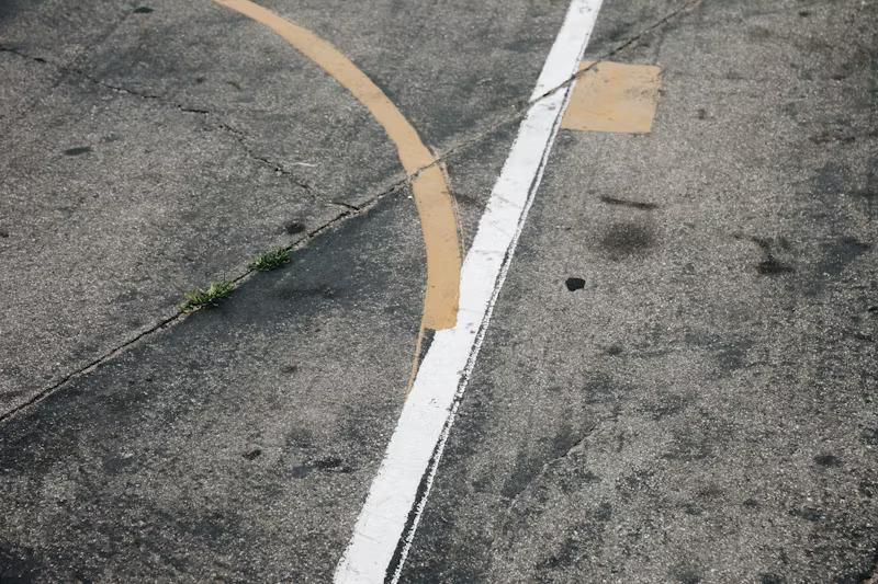 A Close Up of a Basketball Court With a White Line and a Yellow Line — Tiger Concrete ACT In Fadden, ACT