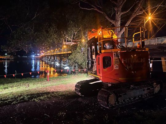 excavator working at night