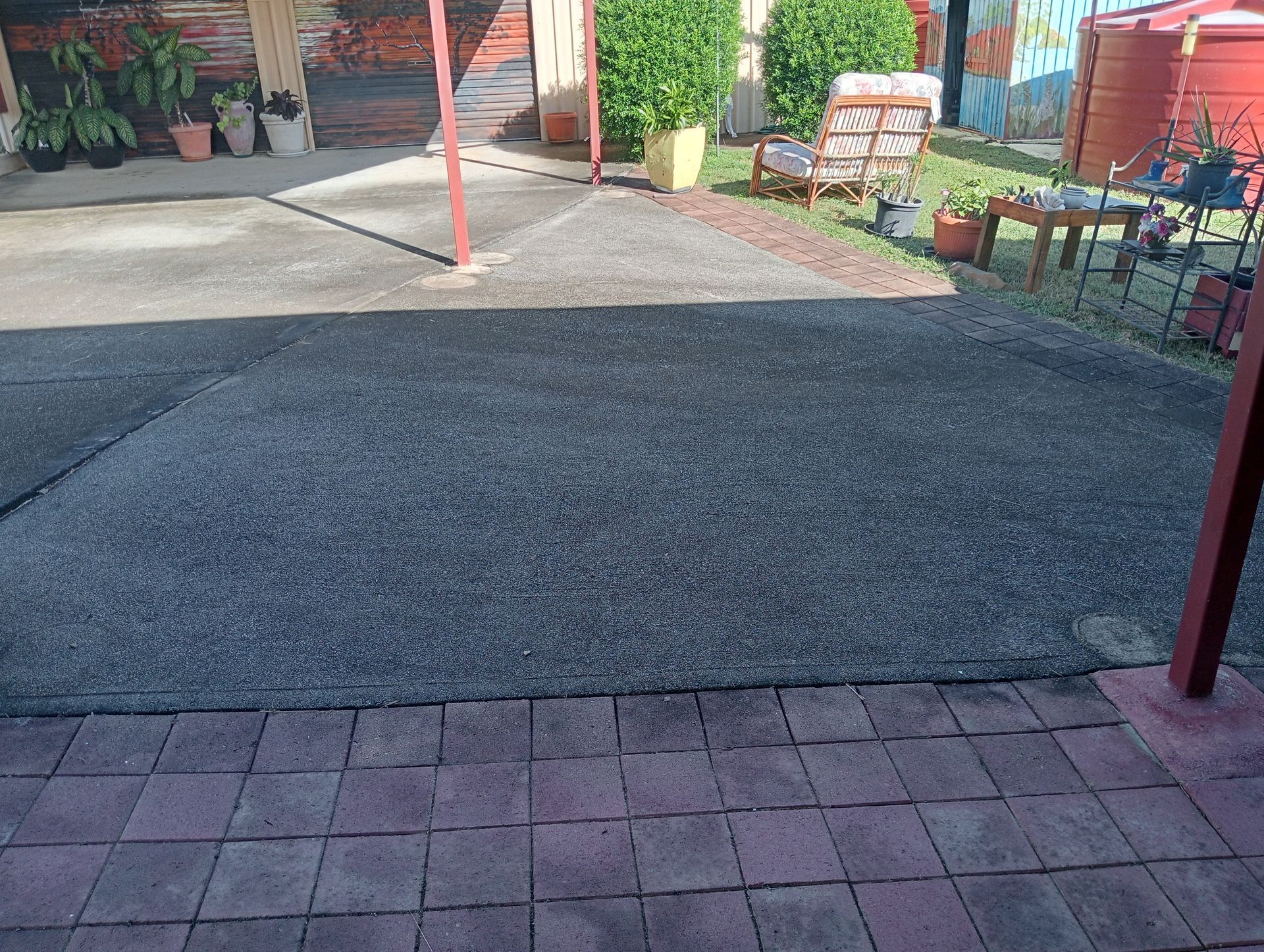 Dark Gravel Driveway Bordered by Red Pavers — All Sparkles Cleaning Technology In Proserpine, QLD