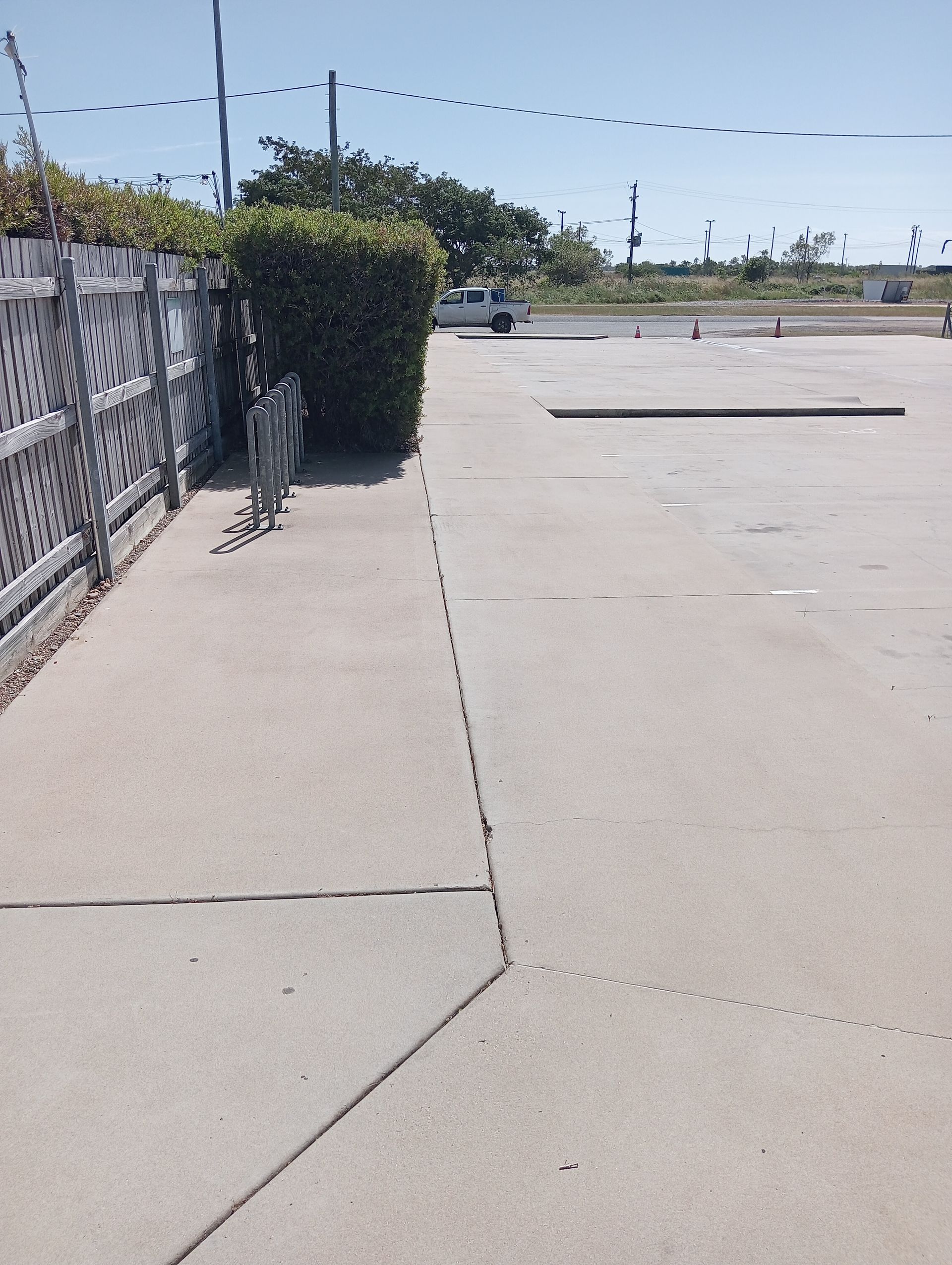 Concrete Sidewalk Next to a Fence and Parking Lot — All Sparkles Cleaning Technology In Home Hill, QLD