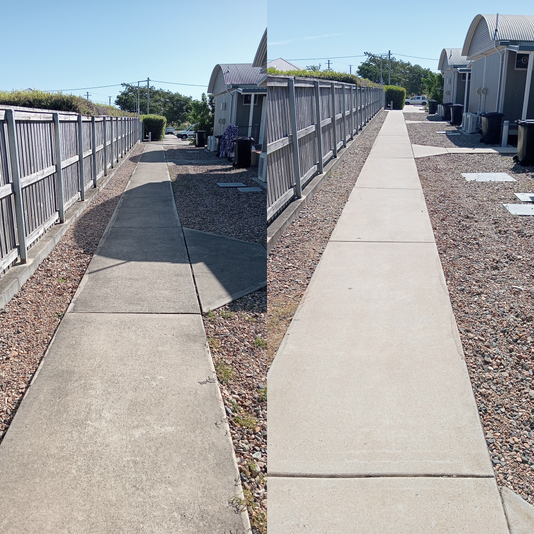 Side-by-side comparison of a concrete sidewalk before (left) and after (right) cleaning, with wooden fences on either side.