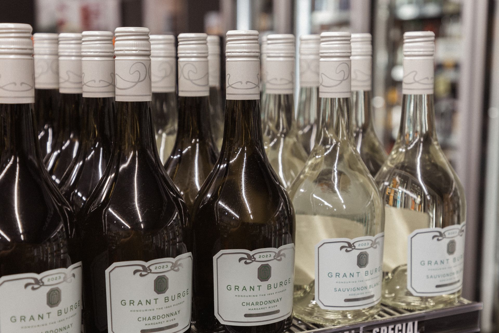 Bottles of wine on a shelf — Wine, Spirits & Beer in Banora Point, QLD