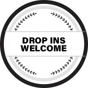 A black and white circle with the words `` drop ins welcome '' on it.