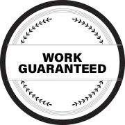 A black and white circle with the words `` work guaranteed '' written inside of it.