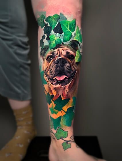 A person has a tattoo of a dog on their leg.